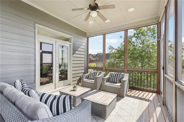 sunroom featuring ceiling fan, french doors, and an outdoor hangout area
