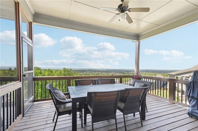 wooden deck featuring ceiling fan and outdoor dining space