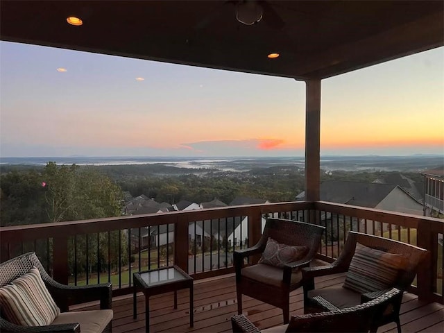 deck at dusk with ceiling fan