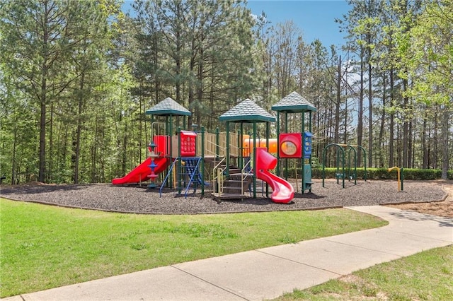 community jungle gym featuring a yard