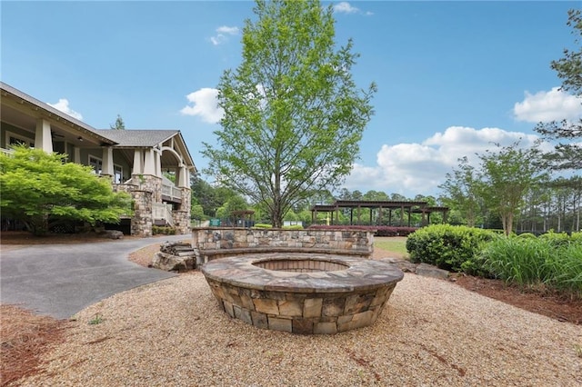 view of community featuring a fire pit