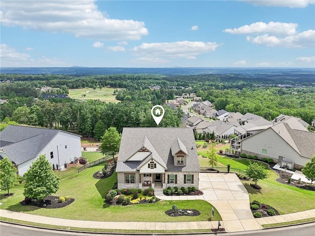 bird's eye view with a residential view and a wooded view