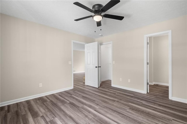 201 Rustin Dr, Dallas, GA 30157 - unfurnished bedroom featuring baseboards, a ceiling fan, a closet, and wood finished floors