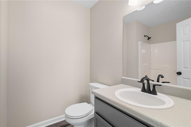 201 Rustin Dr, Dallas, GA 30157 - full bath with toilet, baseboards, a shower, and vanity