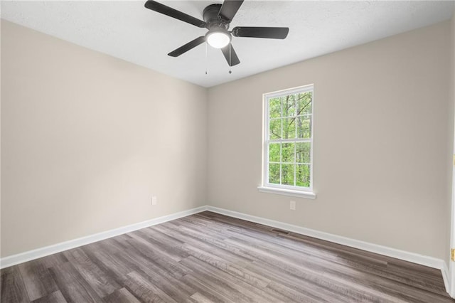 201 Rustin Dr, Dallas, GA 30157 - spare room with dark wood-type flooring and baseboards