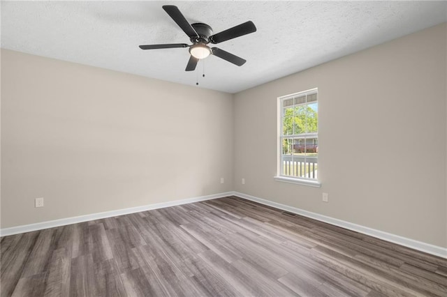 201 Rustin Dr, Dallas, GA 30157 - empty room featuring baseboards, a ceiling fan, and wood finished floors