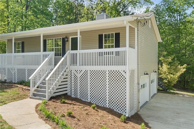 201 Rustin Dr, Dallas, GA 30157 - view of front of home featuring stairs, a chimney, and a porch