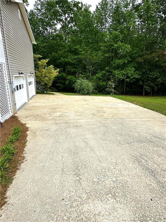 201 Rustin Dr, Dallas, GA 30157 - view of yard with a garage and driveway