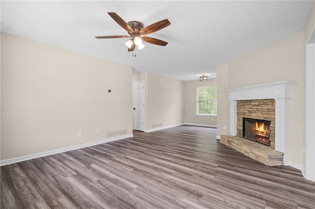 201 Rustin Dr, Dallas, GA 30157 - unfurnished living room with visible vents, wood finished floors, a fireplace, baseboards, and ceiling fan