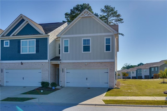 view of front of home featuring a garage and a front lawn