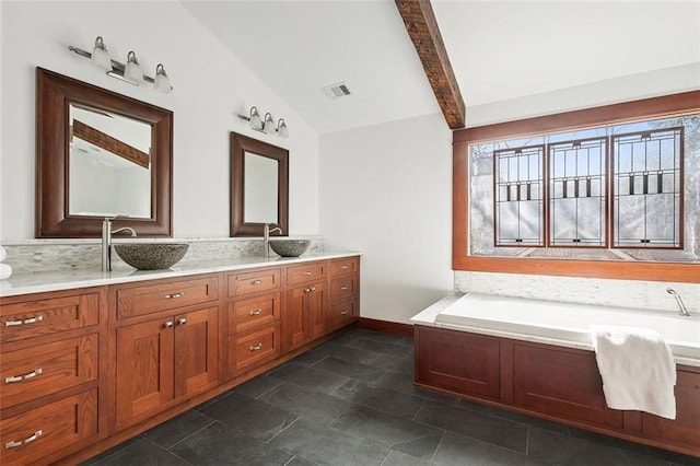 full bathroom with lofted ceiling, double vanity, visible vents, and a sink