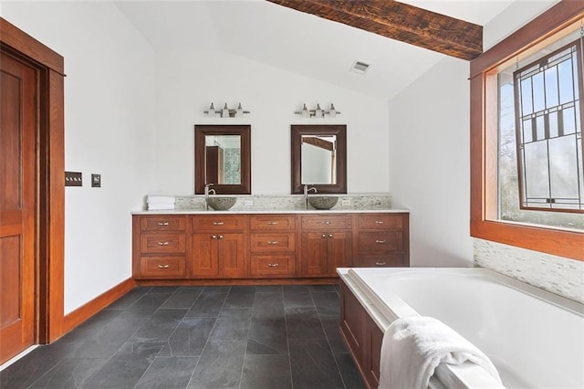 full bath with lofted ceiling with beams, visible vents, a sink, and a bath