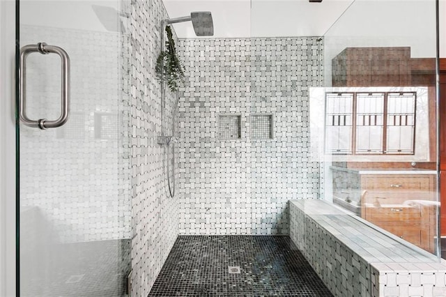 full bathroom featuring a tile shower