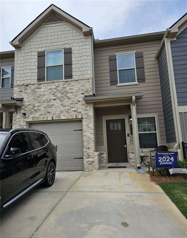 view of front of property with a garage