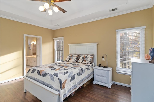 bedroom featuring ornamental molding, connected bathroom, ceiling fan, and dark wood-type flooring