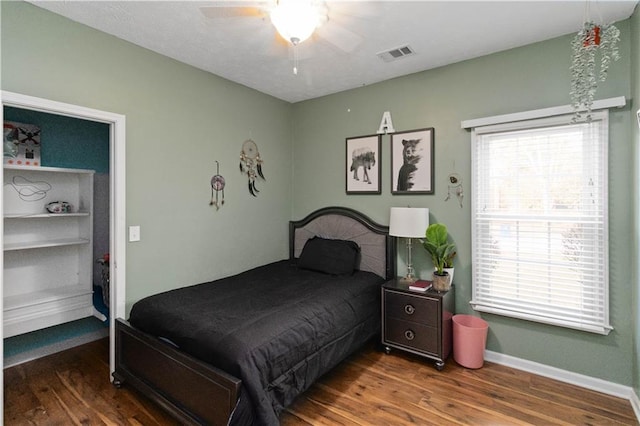 bedroom with hardwood / wood-style flooring and ceiling fan