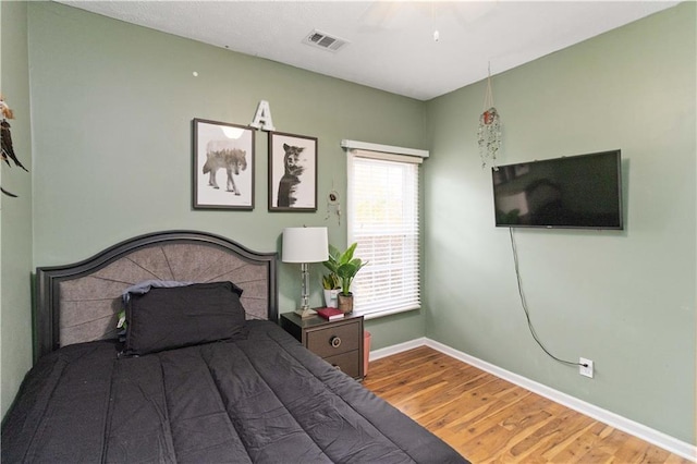 bedroom featuring hardwood / wood-style flooring