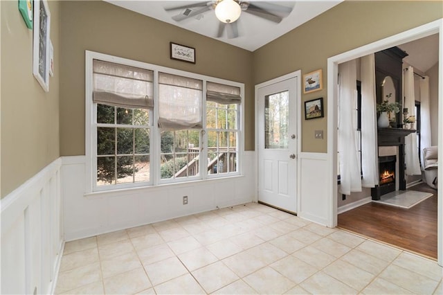 interior space featuring ceiling fan and light wood-type flooring