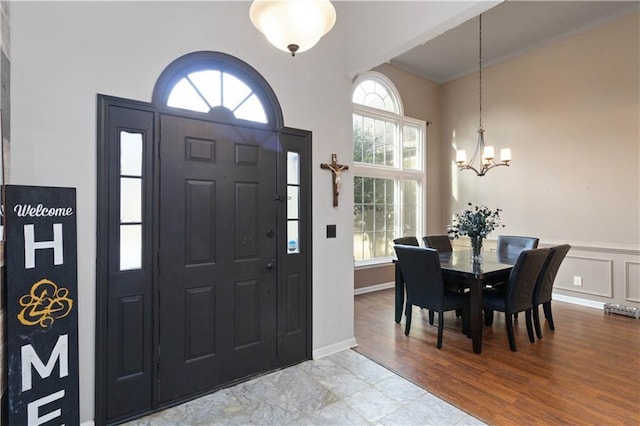 foyer featuring a notable chandelier and light wood-type flooring