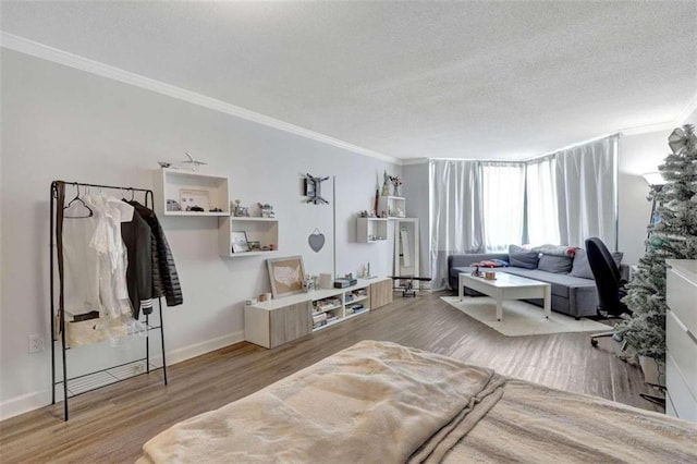 2870 Pharr Ct S Unit 503, Atlanta, GA 30305 - living area with ornamental molding, wood finished floors, a textured ceiling, and baseboards