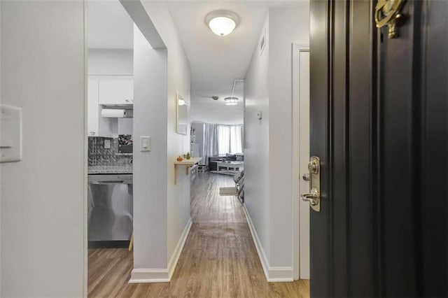 2870 Pharr Ct S Unit 503, Atlanta, GA 30305 - hall with light wood-style floors and baseboards