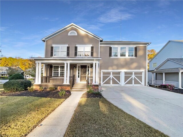 front facade with covered porch and a garage