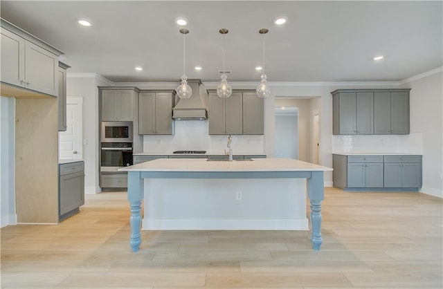 kitchen featuring light countertops, oven, and gray cabinetry