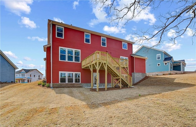 view of front of property with stairway and a wooden deck