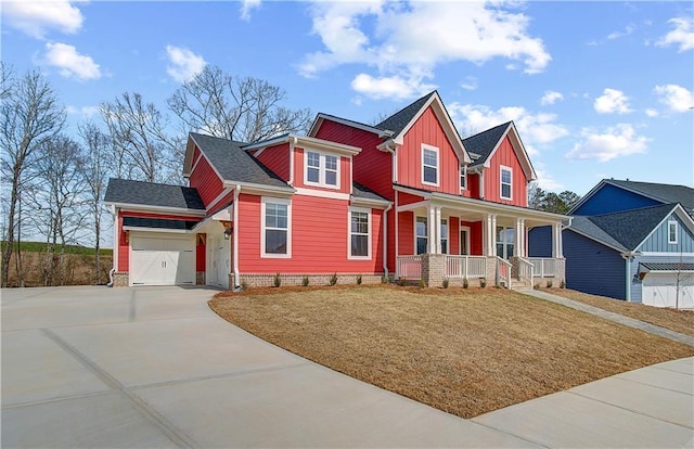 view of front of property featuring a porch, concrete driveway, board and batten siding, a front yard, and a garage