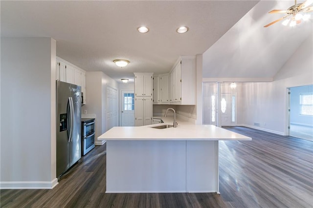 kitchen featuring white cabinets, stainless steel fridge with ice dispenser, dark hardwood / wood-style flooring, and sink