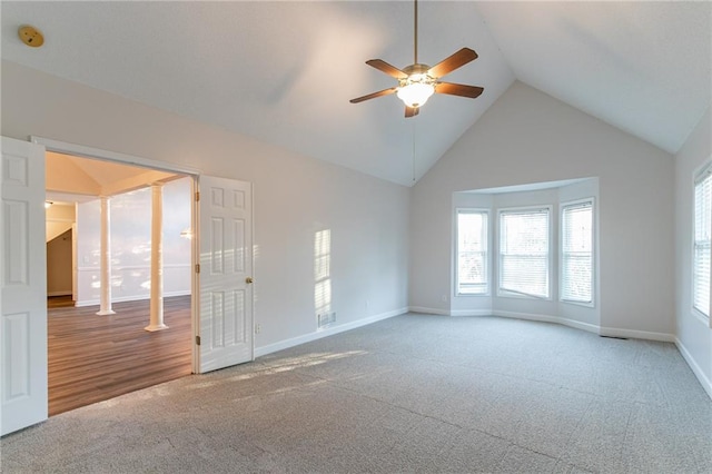 unfurnished living room with wood-type flooring, high vaulted ceiling, and ceiling fan