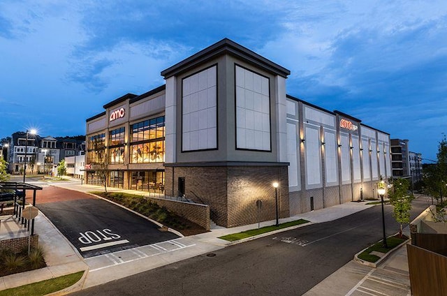 view of outdoor building at dusk