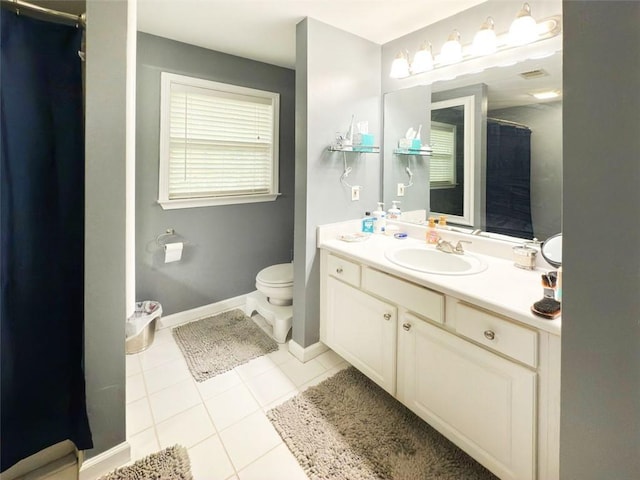 laundry room with light tile patterned floors and stacked washing maching and dryer