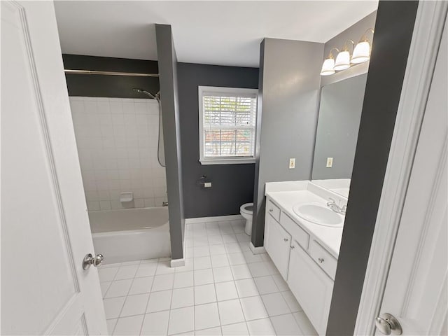 full bathroom with toilet, vanity, tile patterned flooring, and tiled shower / bath