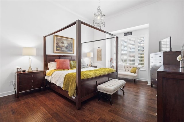 bedroom with hardwood / wood-style floors and baseboards