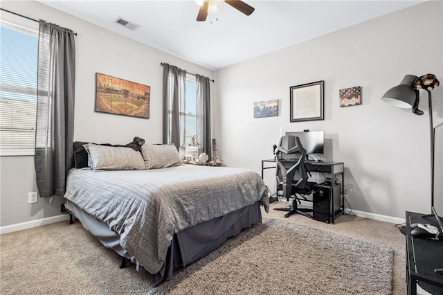 bedroom with baseboards, visible vents, and carpet flooring