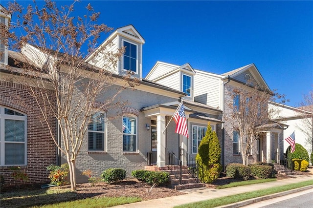 view of front of house featuring brick siding