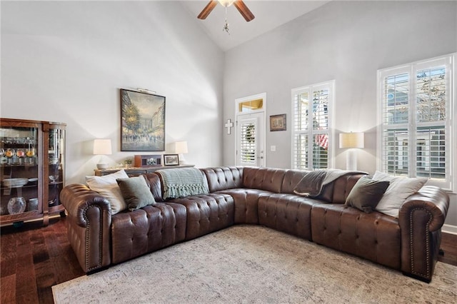 living room with high vaulted ceiling, wood finished floors, and a ceiling fan