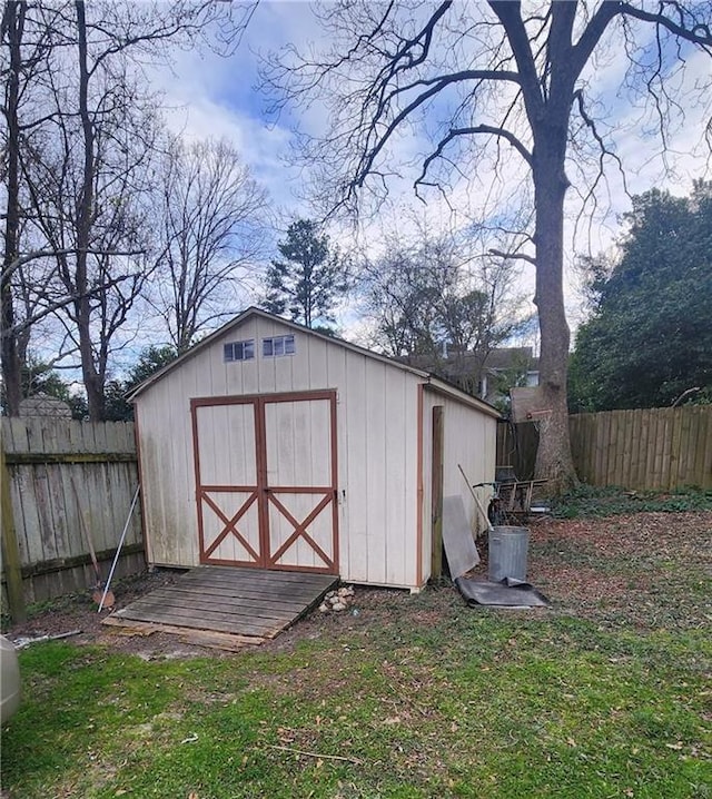 view of shed featuring a fenced backyard