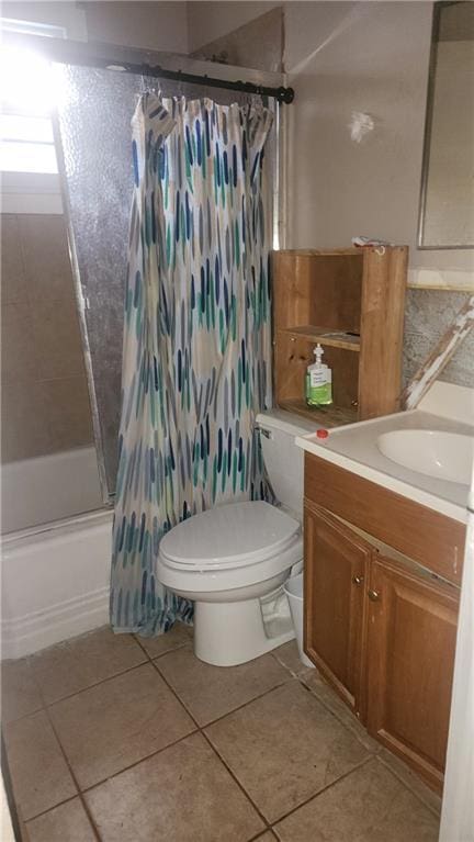 bathroom featuring toilet, shower / bathtub combination with curtain, vanity, and tile patterned floors