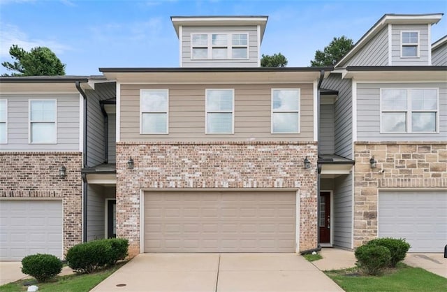 382 Mulberry Row SE, Atlanta, GA 30354 - multi unit property featuring driveway, a garage, and brick siding