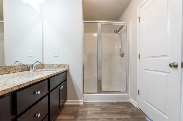 382 Mulberry Row SE, Atlanta, GA 30354 - full bathroom featuring vanity, a stall shower, and wood finished floors