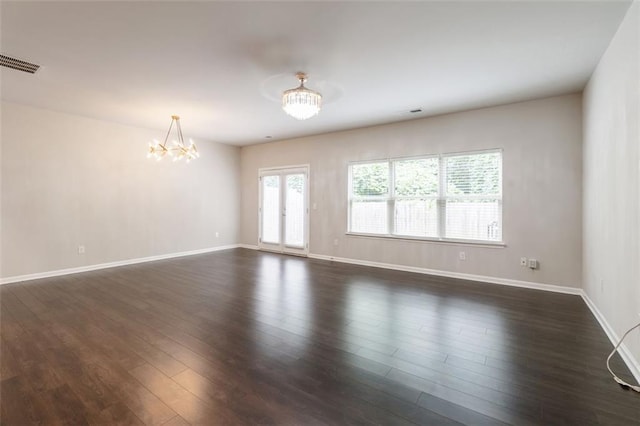 382 Mulberry Row SE, Atlanta, GA 30354 - empty room with a chandelier and dark wood-style flooring