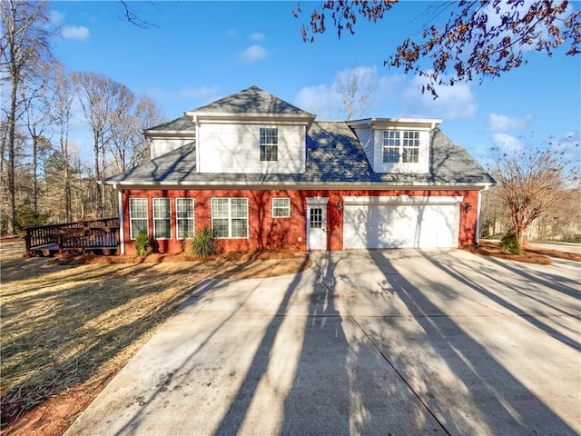 view of front of house featuring a garage and a wooden deck