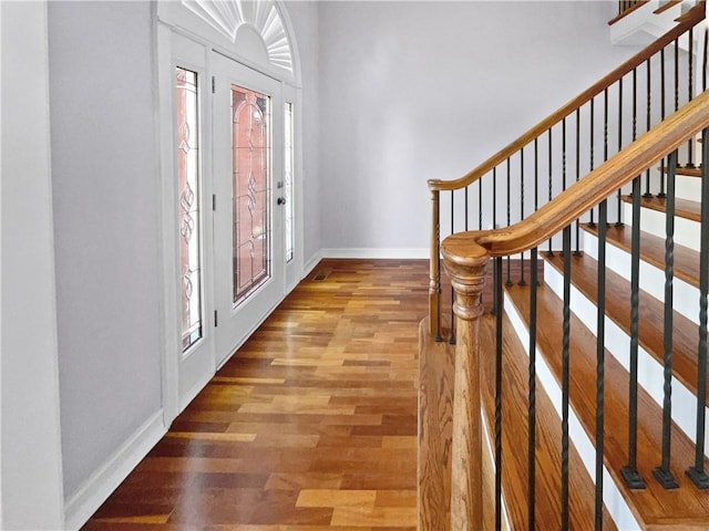 foyer entrance with hardwood / wood-style floors