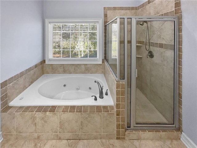 bathroom featuring separate shower and tub