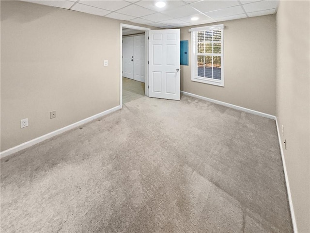 carpeted spare room with electric panel