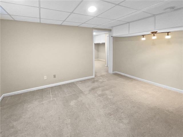 basement featuring light colored carpet