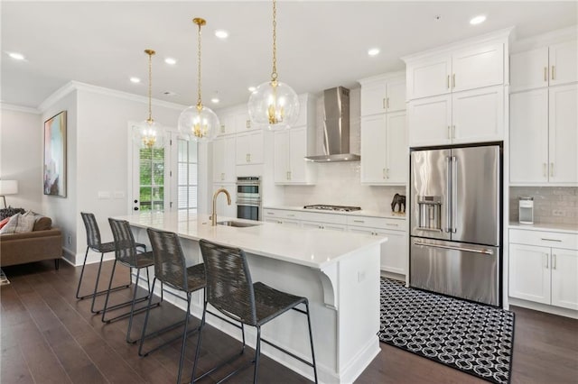 427 Burton Dr, Alpharetta, GA 30009 - kitchen with appliances with stainless steel finishes, wall chimney exhaust hood, a sink, decorative backsplash, and light countertops