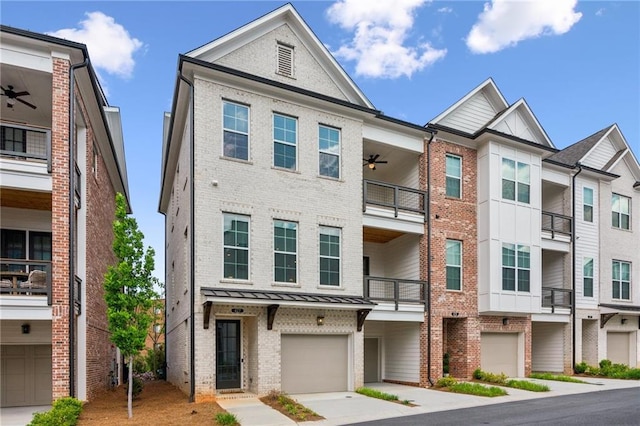 427 Burton Dr, Alpharetta, GA 30009 - townhome / multi-family property with brick siding, an attached garage, a ceiling fan, and driveway